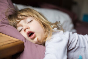 child breathing with open mouth while sleeping